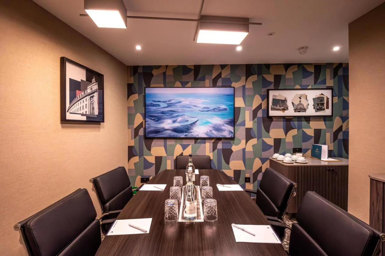 a conference room with a long table and chairs at DoubleTree by Hilton London Victoria in London